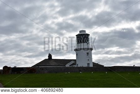 Cloudy Day Over Scenic St Bees Lighthouse In England.
