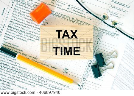 Wooden Blocks With Text Tax Time On Financial Docs