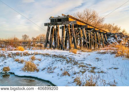 railroad timber trestle destroyed by river flooding - St Vrain Creek near Platteville, Colorado