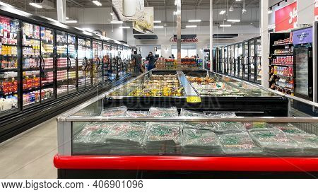 An Overview Of The Refridgerated Section Of A Bravo Market Grocery Store