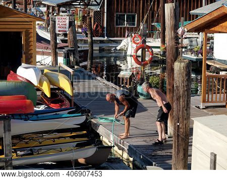 Cowichan, British Columbia, Canada, 08-19-2011, Two Bay Workers Making Preperations For Another Summ