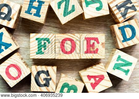 Alphabet Letter Block In Word Foe With Another On Wood Background