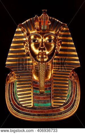 Funerary Burial Mask Of Egyptian Pharaoh Tutankhamun. Isolated On Black Background.