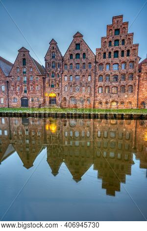 The Medieval Salzspeicher With The Trave River At Dawn, Seen In Luebeck, Germany