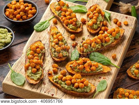 Sweet Potato Toast Loaded With Avocado Guacamole And Baked Chickpeas Sprinkled With Chili Flakes Ser