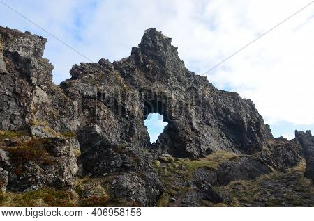 Beautiful Arched Rock Formation In Rural Iceland.
