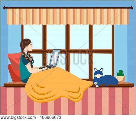 A Woman Works At A Laptop While Sitting On The Windowsill At Home. Freelance Concept, Quarantine Due