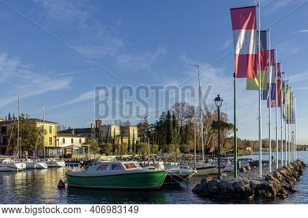 Cisano, Italy - 01 26 2021: The Port Of Cisano Near Sunset On A Winter Afternoon.