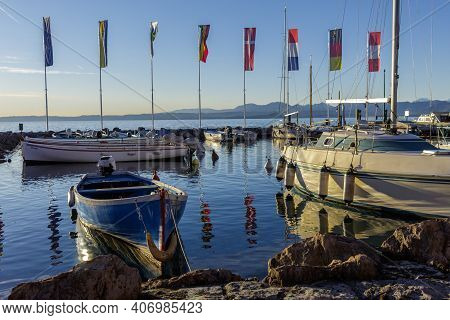 Cisano, Italy - 01 26 2021: The Port Of Cisano Near Sunset On A Winter Afternoon.