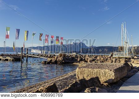Cisano, Italy - 01 26 2021: The Port Of Cisano Near Sunset On A Winter Afternoon.
