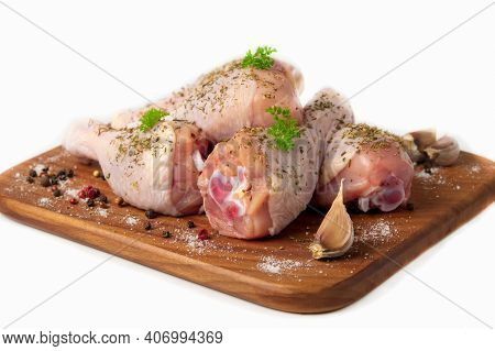 Raw Chicken Drumstick On A Wooden Cutting Board, Spices For Cooking Chicken Drumsticks, Parsley, Pep