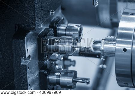 The  Operation Of Multi-tasking Cnc Lathe Machine Swiss Type Cutting The Hi-precision Part. The Hi-t