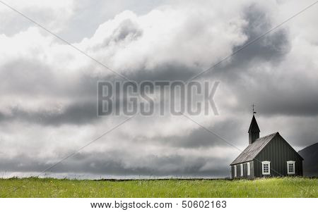 Wooden church and storm