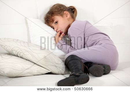 Young girl licking her fingers