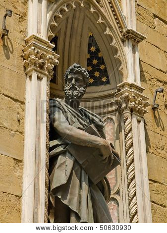 Sculpture Of St. Luke In Facade Of Orsanmichele Church. Florence