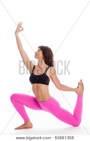Pretty Woman In Yoga Pose - One Legged King Pigeon Position.