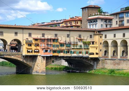 Picturesque view on colorful Ponte Vecchio over Arno River in Florence, Italy