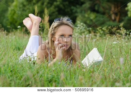 young woman reading book