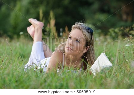 young woman reading book