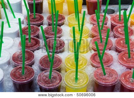 Fresh Juices With Straws At A Market In Barcelona