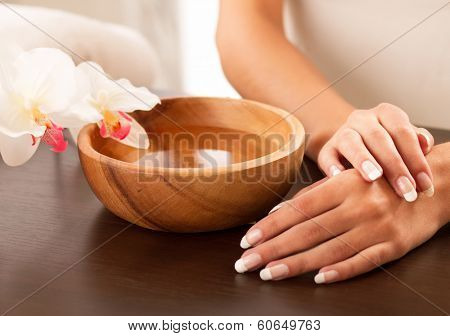Woman's hands lying on the table
