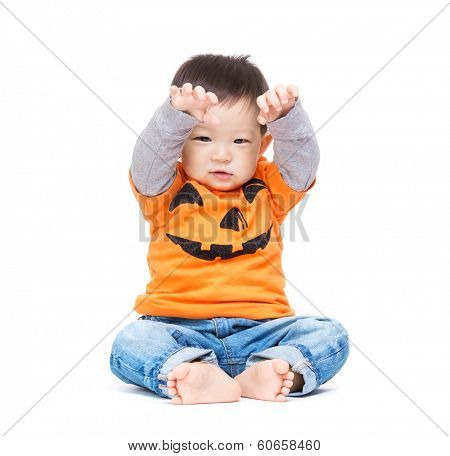Asia baby boy with halloween dressing and hands up