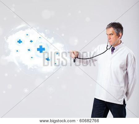 Proffesional doctor listening to abstract cloud with medical signs