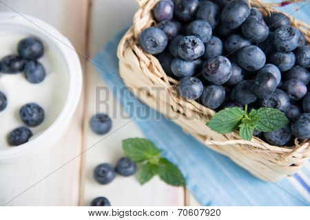 Fresh Blueberries In Basket On Kitchen Table
