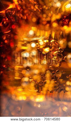 Cola in glass with ice and a bubbles of gas.