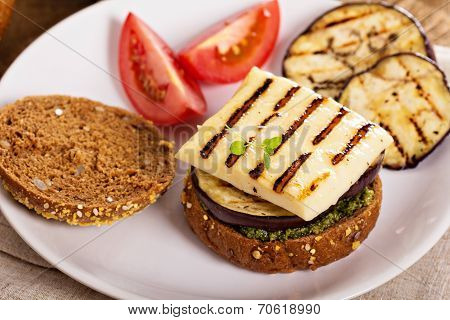 Vegetarian burger with cheese, eggplant and pesto