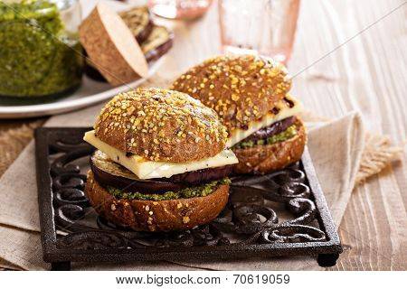Vegetarian burger with cheese, eggplant and pesto
