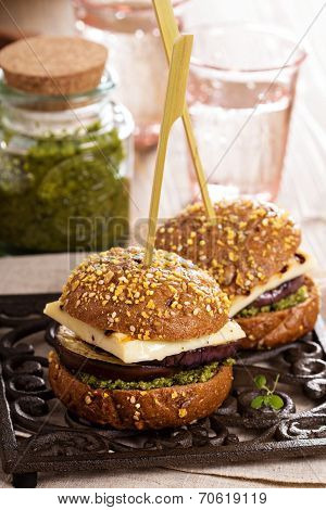 Vegetarian burger with cheese, eggplant and pesto