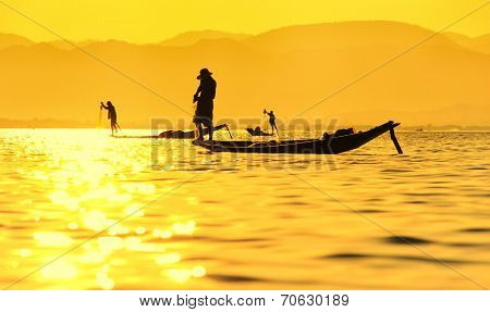 Traveling to Myanmar, outdoor photography of fisherman on traditional boat. Intha people from Shan state of Burma 