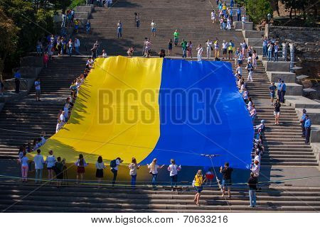 ODESSA, UKRAINE - August 23: Flash mob in city of Odessa on Potemkin Stairs on August 23, 2014, in day of a national flag of Ukraine.