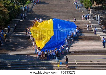 ODESSA, UKRAINE - August 23: Flash mob in city of Odessa on Potemkin Stairs on August 23, 2014, in day of a national flag of Ukraine.