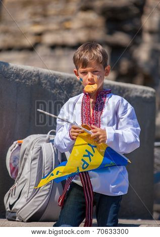 ODESSA, UKRAINE - August 23: Flash mob in city of Odessa on Potemkin Stairs on August 23, 2014, in day of a national flag of Ukraine. Happy participants of summer Flash mob with a flag