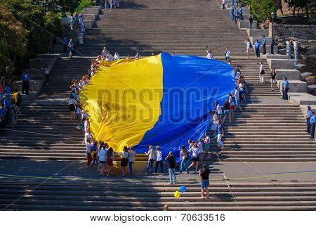ODESSA, UKRAINE - August 23: Flash mob in city of Odessa on Potemkin Stairs on August 23, 2014, in day of a national flag of Ukraine.