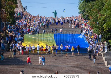 ODESSA, UKRAINE - August 23: Flash mob in city of Odessa on Potemkin Stairs on August 23, 2014, in day of a national flag of Ukraine.