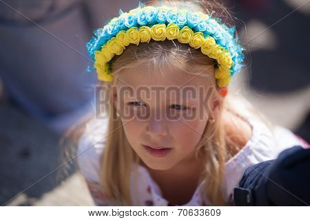 ODESSA, UKRAINE - August 23: Flash mob in city of Odessa on Potemkin Stairs on August 23, 2014, in day of a national flag of Ukraine. Happy participants kids of summer Flash mob with a flag