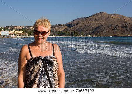 Middle-aged Woman In Sunglasses And Sarongs