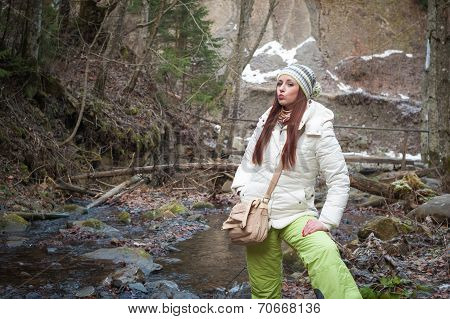 Young Woman On A Mountain River
