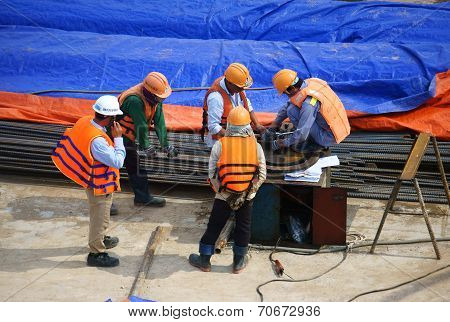 Asia Construction Worker Working On Vietnam Site