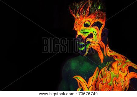 Body art glowing in ultraviolet light -  Fire 