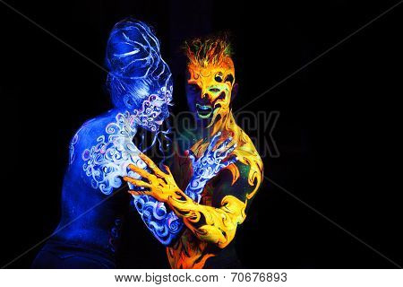 Body art glowing in ultraviolet light,  four elements, Air against Fire