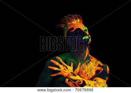 Body art glowing in ultraviolet light -  Fire 