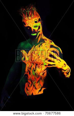 Body art glowing in ultraviolet light -  Fire 