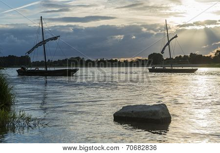Traditional Boats on Loire with Sunset