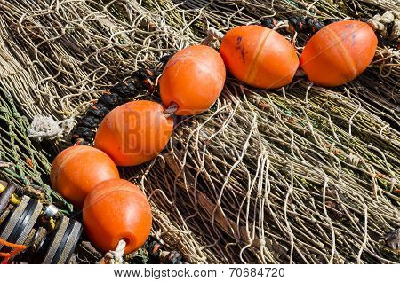Orange Buoy On Fishingf Nets