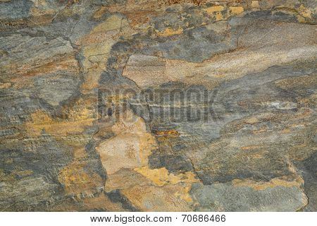 flat, multi color foliated slate rock with abstract like landscape pattern