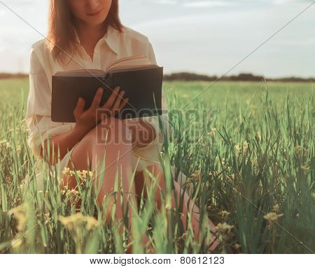 Woman Reading A Book In Summer